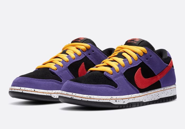 Purple, black, red, and yellow Nike Dunk shoes.